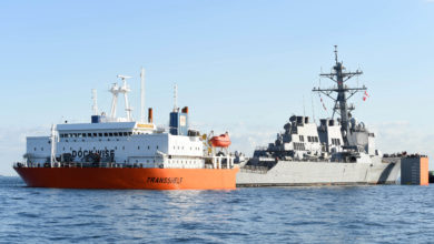 USS Fitzgerald is loaded on a transport ship for final repairs