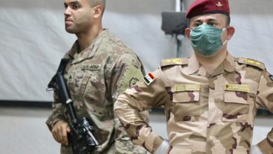A US soldier, left, and an Iraqi army officer at Qayyarah air base in northern Iraq earlier this year