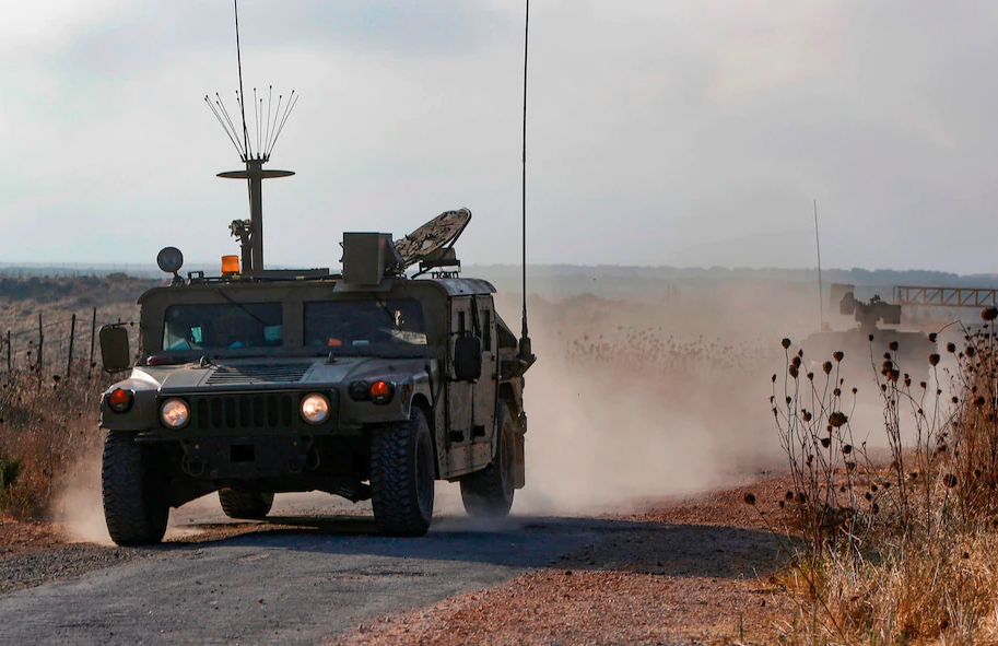 An Israeli military vehicle patrols near the Syrian border in the Israeli-annexed Golan Heights on Aug. 3, near the location where the army said it killed four men placing explosives at a security fence.