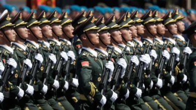 Chinese military troops march on.