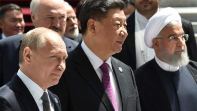 Russian President Vladimir Putin, Chinese President Xi Jinping and Iran's President Hassan Rouhani walk as they attend a meeting of the Shanghai Cooperation Organization (SCO) Council of Heads of State in Bishkek on June 14, 2019.