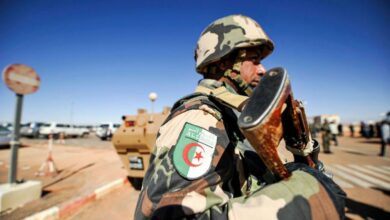 Photo of an Algerian soldier standing guard at the Tiguentourine gas complex, in In Amenas, about 1,600 kilometres southeast of the capital.