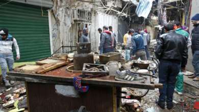 The aftermath of a double bomb attack in a busy market area in Baghdad's central al-Sinaq neighbourhood on December 31, 2016.