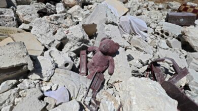 A child's teddy bear is pictured amidst the rubble of a house, following reported shelling by regime forces, in the village of Serja, in the southern part of Syria's Idlib province
