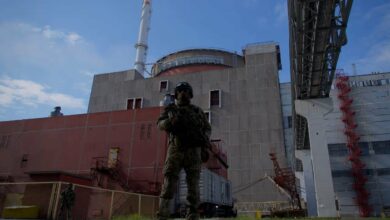 A soldier stands guard outside the Zaporizhzhia nuclear power plant, Ukraine