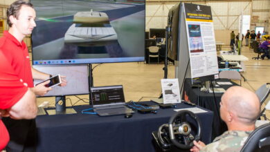 Raytheon Intelligence & Space employee David Kwietniewski demonstrates RedProZTX to US government personnel at Yuma Proving Ground during Project Convergence 2022.