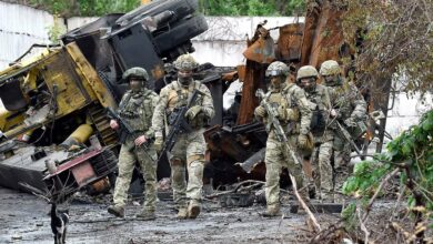 Russian servicemen patrol the destroyed part of the Ilyich Iron and Steel Works in Ukraine’s port city of Mariupol