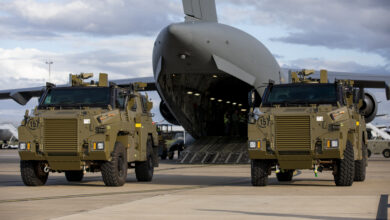 Two Bushmaster protected mobility vehicles bound for Ukraine wait to be loaded onto a C-17A Globemaster III aircraft at RAAF Base Amberley, Queensland. *** Local Caption *** The Australian Government has provided further support to the Government of Ukraine by gifting 20 Bushmaster Protected Mobility Vehicles, including two ambulance variants, to aid the Government of Ukraines response to Russias unrelenting and illegal aggression. Australias response follows a direct request from President Zelenskyy during his address to a joint sitting of the Parliament of Australia on 31 March 2022. The Bushmaster Protected Mobility Vehicle was built in Australia to provide protected mobility transport, safely moving soldiers to a battle area prior to dismounting for close combat. The Bushmaster Protected Mobility Vehicle is well suited to provide protection to the Ukrainian Armed Forces soldiers and Ukrainian civilians against mines and improvised explosive devices, shrapnel from artillery and small arms fire. The vehicles have been painted olive green to suit the operating environment. Additionally, a Ukrainian flag is painted on either side with the words United with Ukraine stencilled in English and Ukrainian to acknowledge our commitment and support to the Government and people of Ukraine. The ambulances will have the traditional red cross emblem. The Bushmaster Protected Mobility Vehicles will be fitted with radios, a global positioning system and additional bolt-on armour increasing their protection.