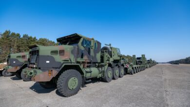 U.S. Army Enhanced Heavy Equipment Transporter Systems line up for a convoy, in a staging area of the Army Prepositioned Stock-2 site, in Zutendaal, Belgium, Mar. 09, 2022. Army Prepositioned Stocks is a U.S. Department of the Army program in which equipment sets are stored around the globe for use when a combatant commander requires additional capabilities. The U.S. Army has seven APS regions and APS-2 is designated for Europe. APS sites reduce deployment timelines, improve deterrence capabilities, and provide additional combat power for contingency operations. (U.S. Army photo by Pierre-Etienne Courtejoie)
