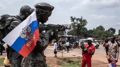 A Russian flag emblazoned with the emblem of Russia hangs on a monument to Russia’s so-called military instructors in Bangui, Central African Republic