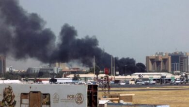 Heavy smoke billows above buildings in the Sudanese capital