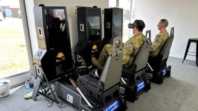 Army officers test out Ryan Aerospace's virtual reality flight simulators at the Australian International Airshow.