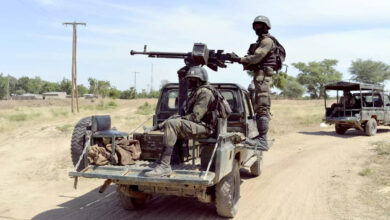 A photo taken on Nov. 12 shows Cameroonian soldiers patrolling in Amchide, less than a mile from the border with Nigeria