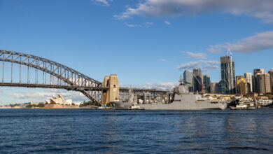 Royal Australian Navy replenishment ship HMAS Supply sails through Sydney Harbour after taking on fuel from the commercial fuel depot at Gore Cove. *** Local Caption *** Royal Australian Navy replenishment ship HMAS Supply completed another first since commissioning after passing under Sydney Harbour Bridge on Wednesday, 18 May 2022. HMAS Supply took on fuel from the commercial fuel depot at Gore Cove on the western side of Sydney Harbour Bridge ahead of departing Fleet Base East as part of a regional presence deployment en route to Exercise Rim of the Pacific (RIMPAC) in Hawaii. This was another first for the Supply-class oiler replenishment ships -- HMAS Supply and HMAS Stalwart -- as they continue to expand their operating capability. HMAS Supply was commissioned on 10 April 2021 and the second ship, HMAS Stalwart, was commissioned seven months later on 13 November 2021. The double-hulled ships carry fuel, dry cargo, water, food, ammunition, equipment and spare parts to provide operational support for deployed Navy ships and to support Australian Defence Force operations far from the port. HMAS Supply has already provided vital support to Operation Tonga Assist 2022.