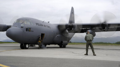 Members of the Polish air force C-130 Hercules maintenance crew ensure the propellers are working on the aircraft during Red Flag-Alaska on Joint Base Elmendorf-Richardson, Alaska, June 13, 2012. The goal of Red Flag-Alaska is to provide each aircrew with vital first missions to increase their chances of survival in combat environments.