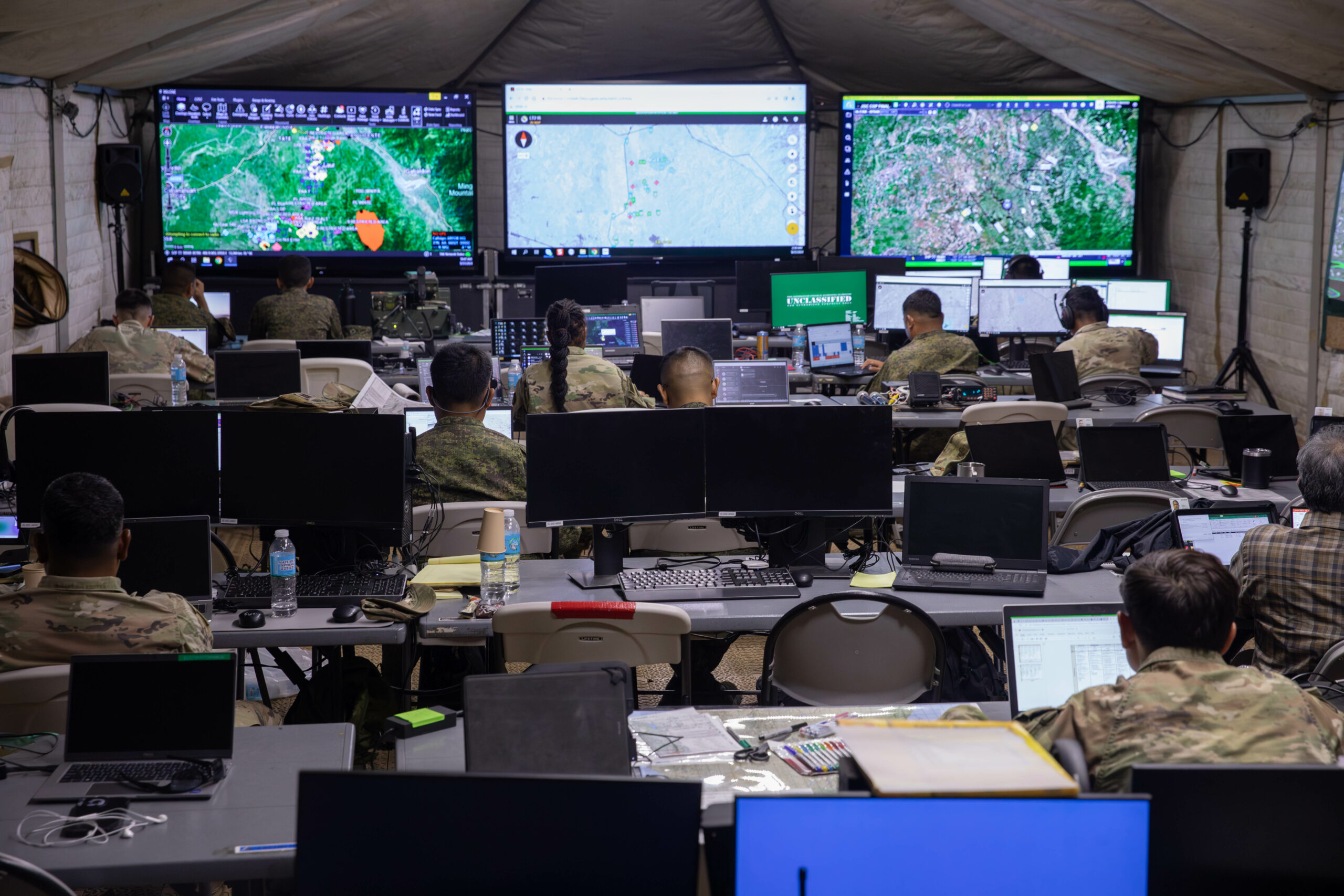 U.S. and Philippines Army soldiers work in the Joint Operations Center during the Joint Pacific Multinational Readiness Center-Exportable (JPMRC-X) exercise on Fort Magsaysay, Philippines, 31 May 2024. This iteration of JPMRC-X marks the first deployment to the Philippines, which will enable and assist the Philippines Army and the Armed Forces of the Philippines in building combat training center locations within the Philippines. The JPMRC-X is a Department of the Army initiative consisting of a deployable package of personnel and equipment designed to support training exercises across the Pacific. (U.S. Army National Guard photo by Staff Sgt. Tommie Berry)
