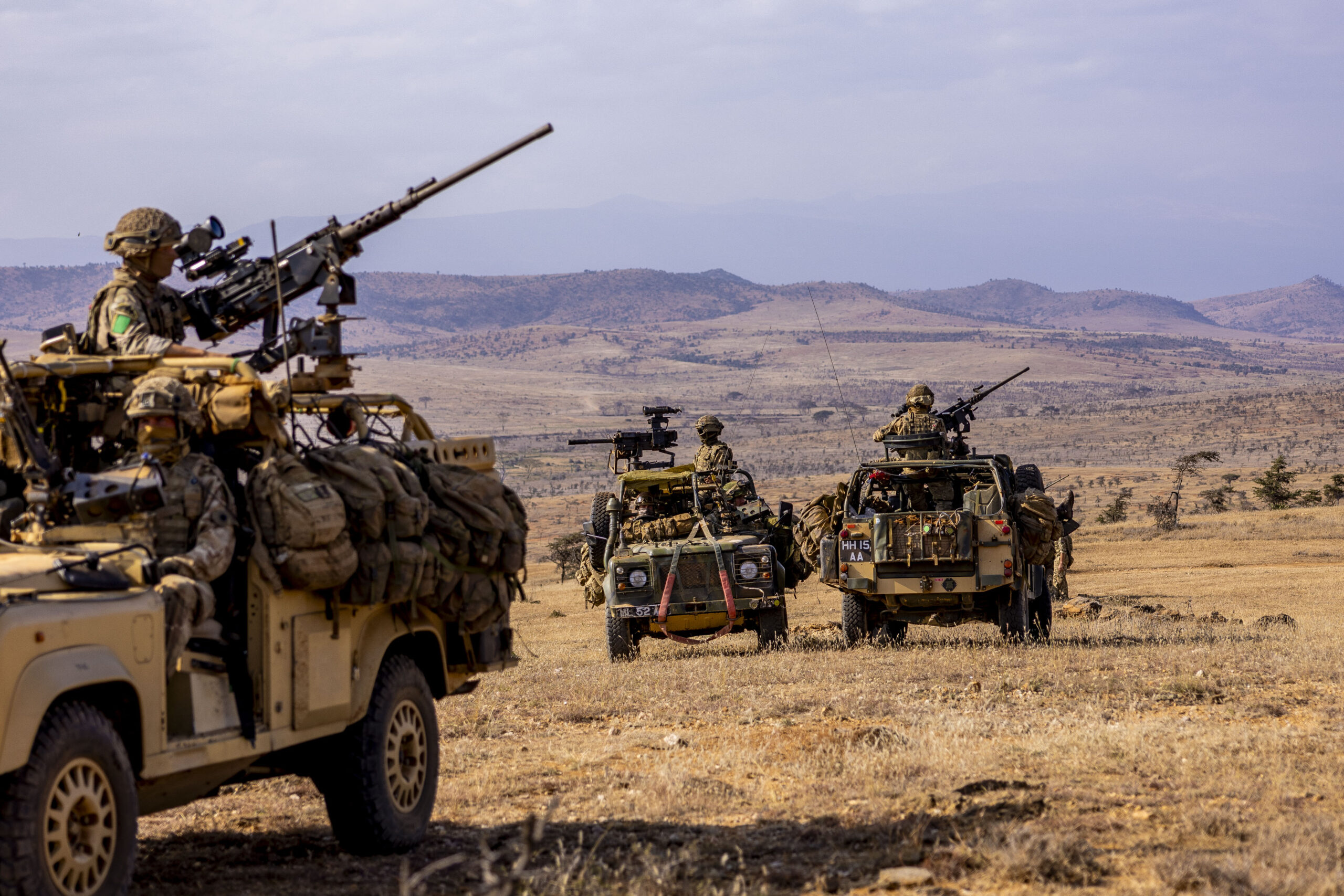 Members from Machine Guns Platoon, Support Company, 3rd Battalion, The Parachute Regiment, mounted in Revised Weapons Mounted Installation Kit (RWMIK) sat back in reserve ready to punch forward onto the objective during Exercise Haraka Storm, Kenya, on the 21st of July 2023. The British Armys global response force has tested its ability to deploy and fight at short notice in some of Africas most challenging environments. The soldiers of 3 PARA Battlegroup honed both their fighting and fieldcraft skills on the Kenyan savannah as part of the six-week long Exercise Haraka Storm. Dealing with the rough terrain, searing heat and potentially deadly animals - ranging from lions and elephants to scorpions and snakes  troops followed a progression of training, building from polishing their individual skills and specialities to a final mission which sees the whole force operating together to assault a heavily-defended objective. The 1,000-strong battlegroup is built around the airborne infantry of Colchester-based 3rd Battalion The Parachute Regiment, bolstered by artillery, engineers, signallers, medics, and logisticians from across 16 Air Assault Brigade Combat Team. Specially trained and equipped to deploy by parachute, helicopter or airlanding, the 3 PARA Battlegroup is currently held at very high readiness to respond to global crises. In April, it deployed to Sudan to provide security and logistic support to the evacuation of British civilians.