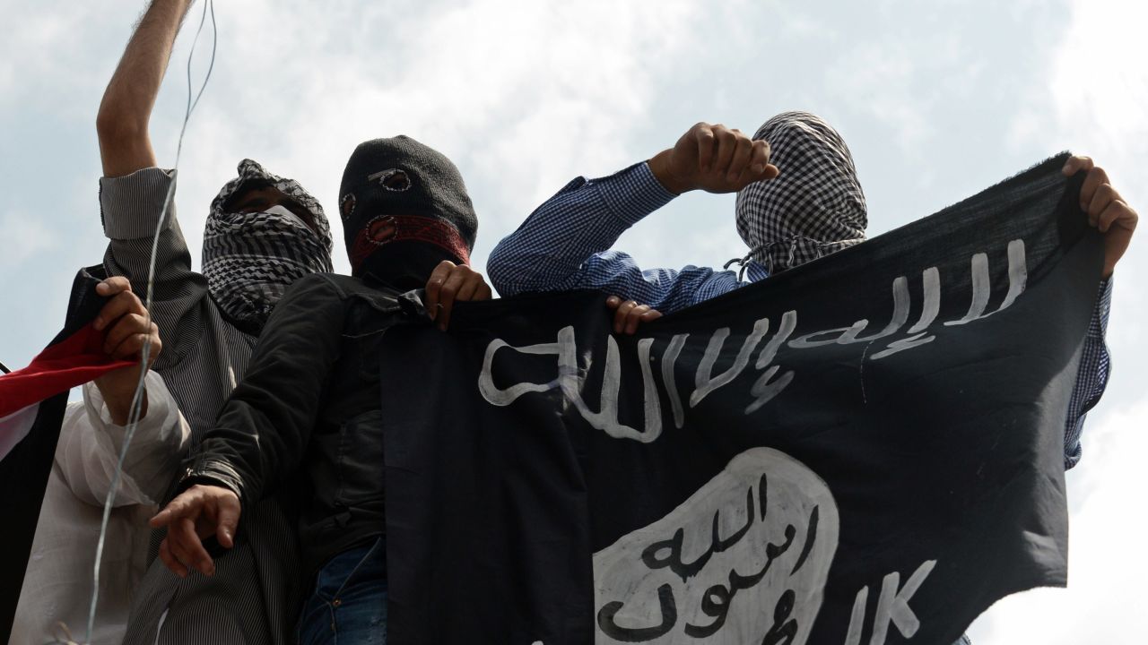 Kashmiri demonstrators hold up a flag of the Islamic State of Iraq and the Levant (ISIL) during a demonstration against Israeli military operations in Gaza, in downtown Srinagar on July 18, 2014. TAUSEEF MUSTAFA/AFP/AFP/Getty Images