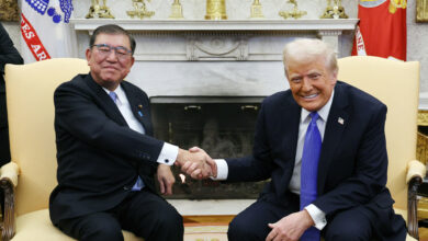 Japanese Prime Minister Shigeru Ishiba (L) and U.S. President Donald Trump shake their hands during a bilateral meeting at the White House in Washington D.C., United States of America, on February 7, 2025. ( The Yomiuri Shimbun ) (Photo by Nanako Sudo / Yomiuri / The Yomiuri Shimbun via AFP)