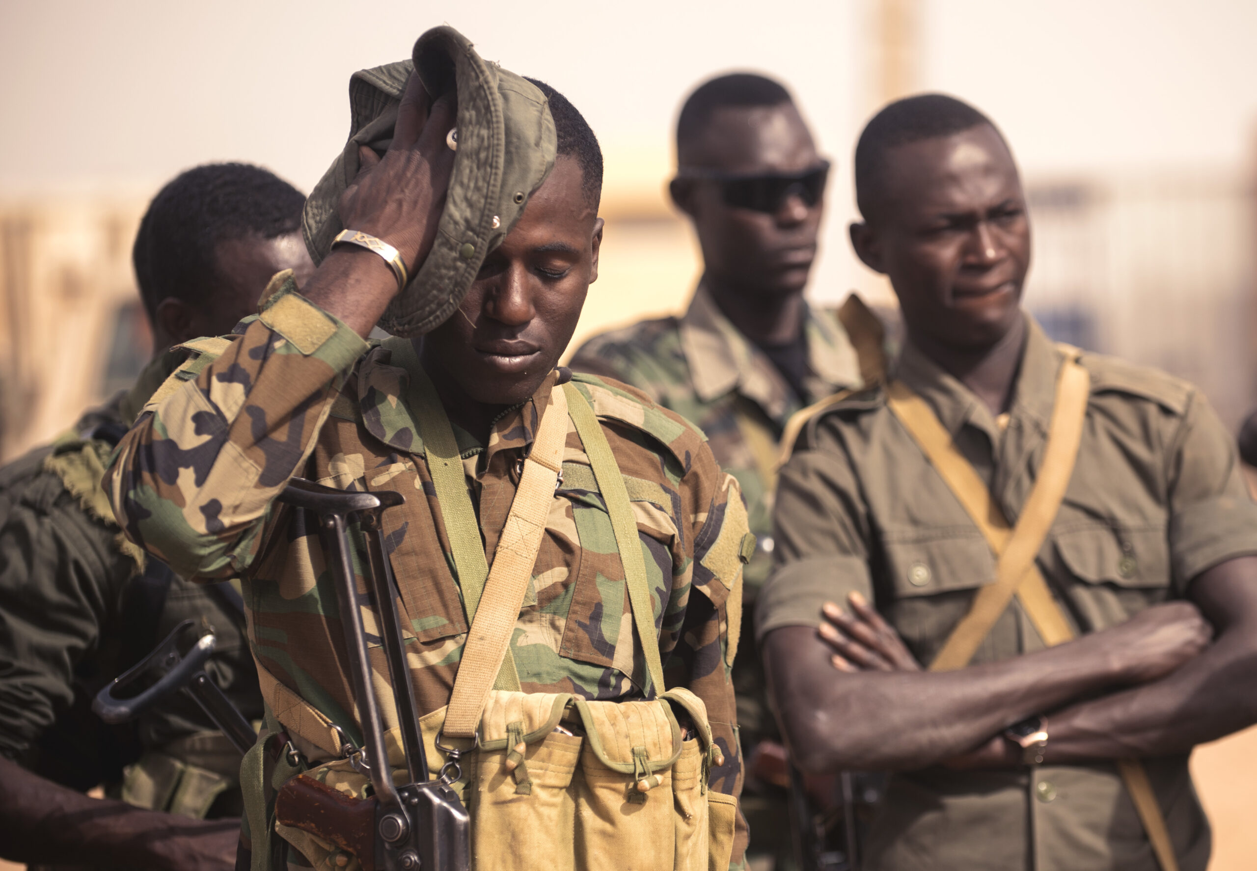 A Nigerian soldier wipes sweat off his face while participating in a special forces training exercise during Exercise Flintlock 2018 in Agadez, Niger, April 14, 2018. Flintlock is an annual, African-led, integrated military and law enforcement exercise working with multinational special operations groups. The exercise is designed to strengthen the ability of key partner nations in the region to counter violent extremist organizations, protect their borders, and provide security for their people. (U.S. Navy photo by MC3 (SW/AW) Evan Parker/Released)