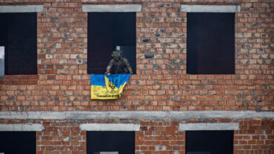 Armed Forces of Ukraine soldier places a Ukrainian flag on the building his unit cleared during urban operation demonstration. This demonstration was for visiting dignitaries from various participating nations. Rapid Trident 2021 involves approximately 6,200 personnel from 12 nations, Sept. 20- Oct. 1, 2021, at the International Peacekeeping Security Centre near Yavoriv, Ukraine. Rapid Trident is an annual, multinational exercise that supports joint combined interoperability among the partner militaries of Ukraine and the United States, as well as Partnership for Peace nations and NATO allies