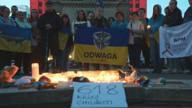 Ukrainians living in Poland take part in a vigil for victims of the Russian attack on Sumy on Palm Sunday in Warsaw, Poland on 13 April, 2025. (Photo by Jaap Arriens/NurPhoto) (Photo by Jaap Arriens / NurPhoto / NurPhoto via AFP)
