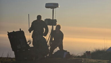 US Marines and Collins Aerospace team members assemble nodes at dawn during Project Convergence Capstone 5