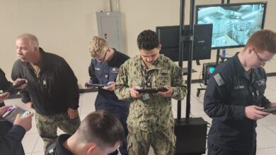 Soldiers testing the Mobile-Navy Enhanced Simulation for Training (Mobile-NEST) handheld devices