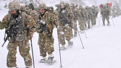 Cold Weather Leaders Course students move through the rugged terrain at the Northern Warfare Training Center's Black Rapids Training Site during a snowstorm. NWTC cadre worked overtime to help meet the increased need for more Arctic experts in the units to help pass critical knowledge throughout the formations. (Army photo/John Pennell)