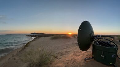 Archer Troposcatter technology on the ground facing the sunset