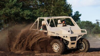 A soldier driving an Ermine ground vehicle