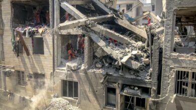 Photo from inside a house across a targeted residential building shows extensive damage in Tehran, Iran, on June 13, 2025