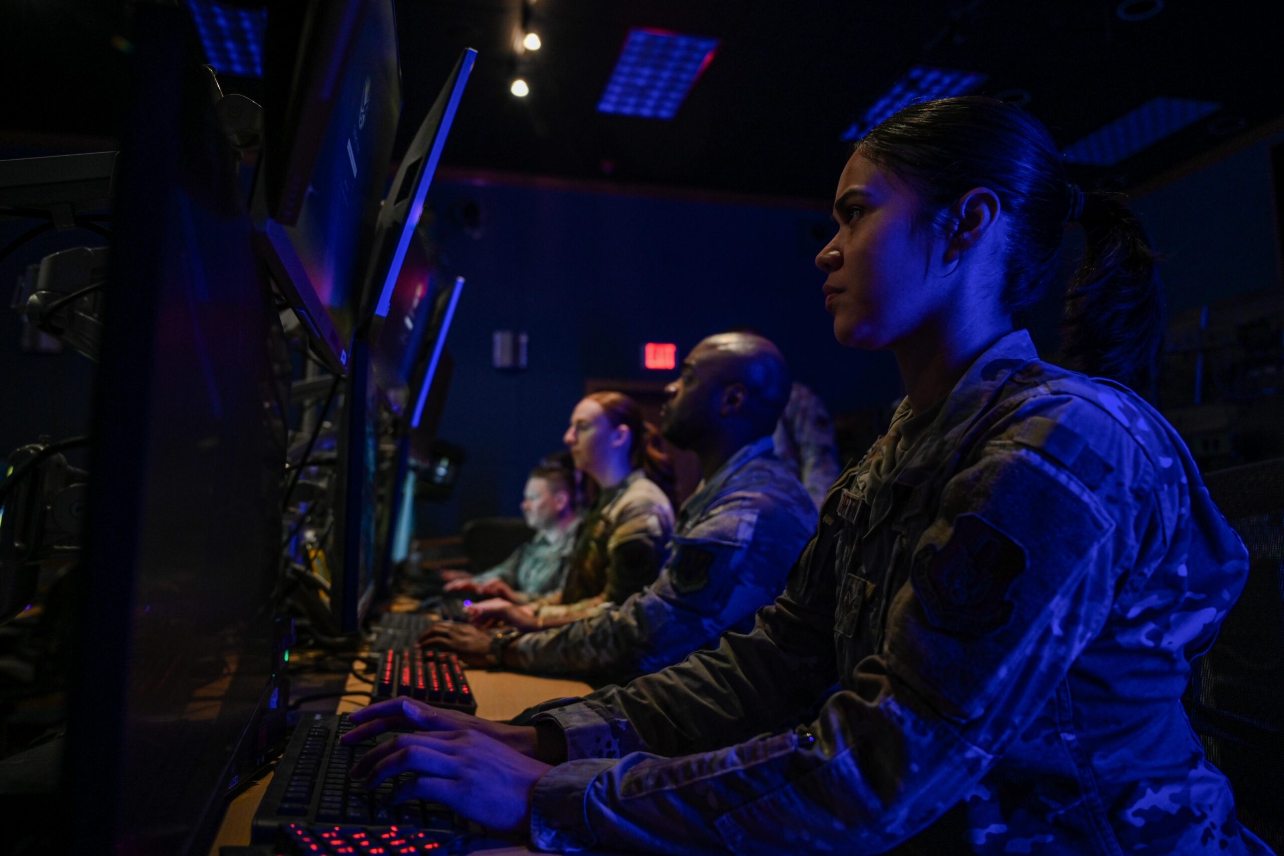 U.S. Air Force Airmen with the 67th Cyberspace Wing's 367th Cyberspace Operations Squadron prepare for daily mission tasks at Joint Base San Antonio-Lackland, March 31, 2025. The Airmen of the 67th Cyberspace wing remain at the ready to defend in the nation against any cyber threat. (U.S. Air Force photo by Jantzen Floate)
