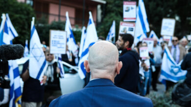 People hold flags during a pro-Israel demonstration outside Israels embassy in Athens, Greece, on Wednesday, Oct. 18, 2023. (Photo by Aris Oikonomou / SOOC via AFP)