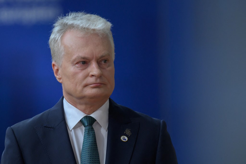 Lithuania President Gitanas Nauseda arriving at EU summit with blue background