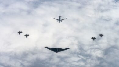 A US Air Force B-2 Spirit, center, from the 72nd Test and Evaluation Squadron assigned to the 53rd Wing, a Royal Norwegian Air Force P-8 Poseidon, center back, and four Royal Norwegian Air Force F-35 Lightning II, right and left, fly in formation over Norway.