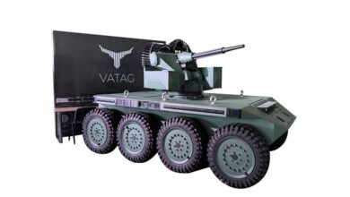 A green VATAG robotic vehicle unit against a white background
