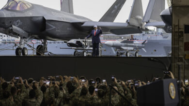 President Donald Trump rides an aircraft elevator aboard Nimitz-class aircraft carrier USS George Washington (CVN 73) during a presidential visit while moored pierside on Commander, Fleet Activities Yokosuka, Oct. 28, 2025. During his visit, President Donald Trump met with U.S. and Japanese leaders, coined Sailors, and addressed the ship’s crew. George Washington is the U.S. Navy’s premier forward-deployed aircraft carrier, a long-standing symbol of the United States’ commitment to maintaining a free and open Indo-Pacific region, while operating alongside allies and partners across the U.S. Navy’s largest numbered fleet. (U.S. Navy photo by Mass Communication Specialist Seaman Roselia Garcia)