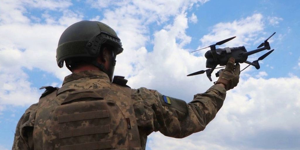 A Ukrainian soldier preparing a drone for use.