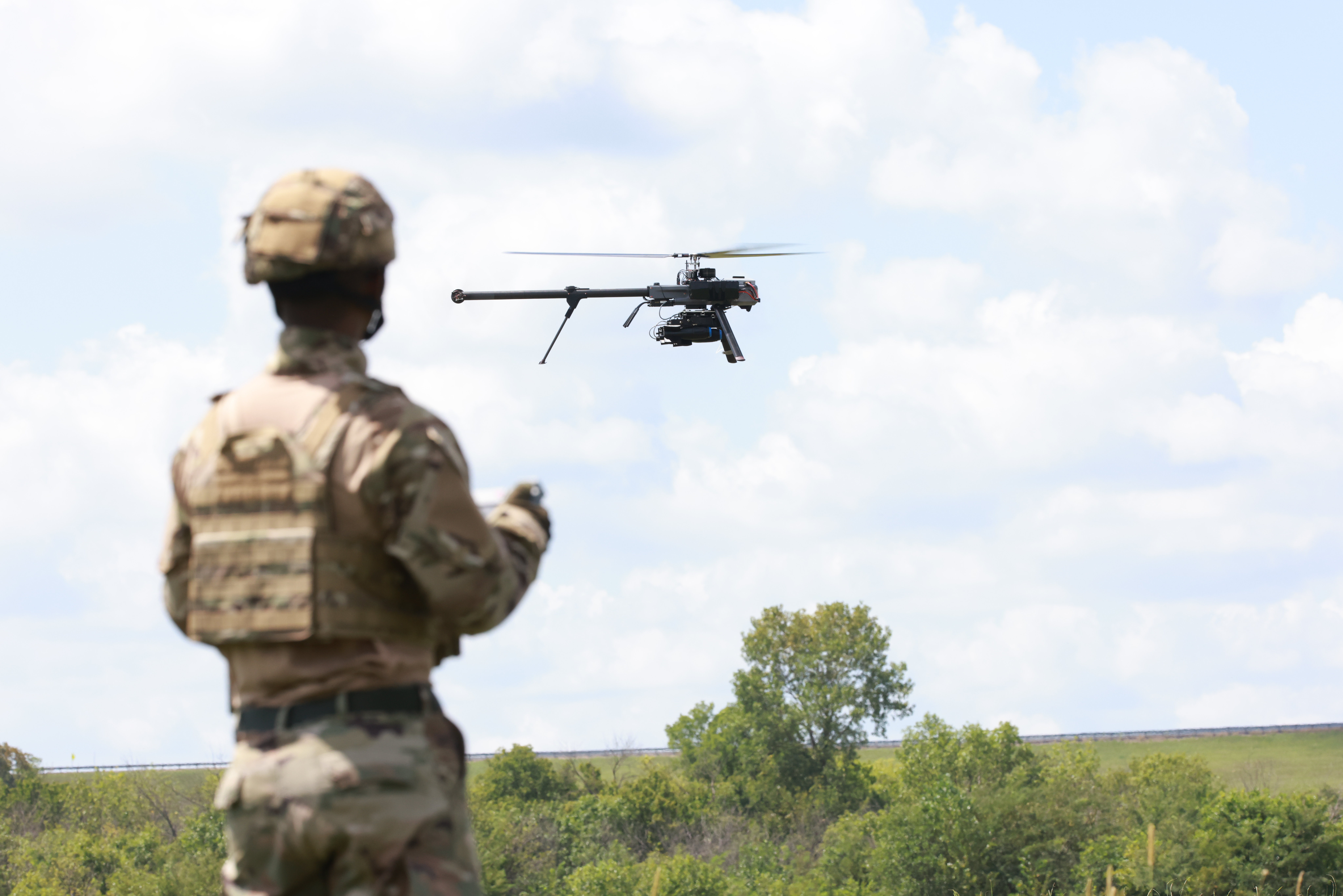 A soldier controlling the Vapor CLE system with daylight background