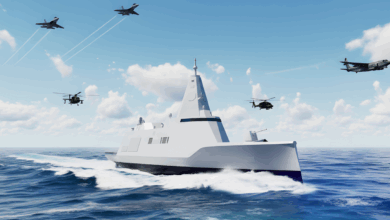 Hanwha Ocean's surface warship concept shown traveling at sea with helicopters and jets flying in the background