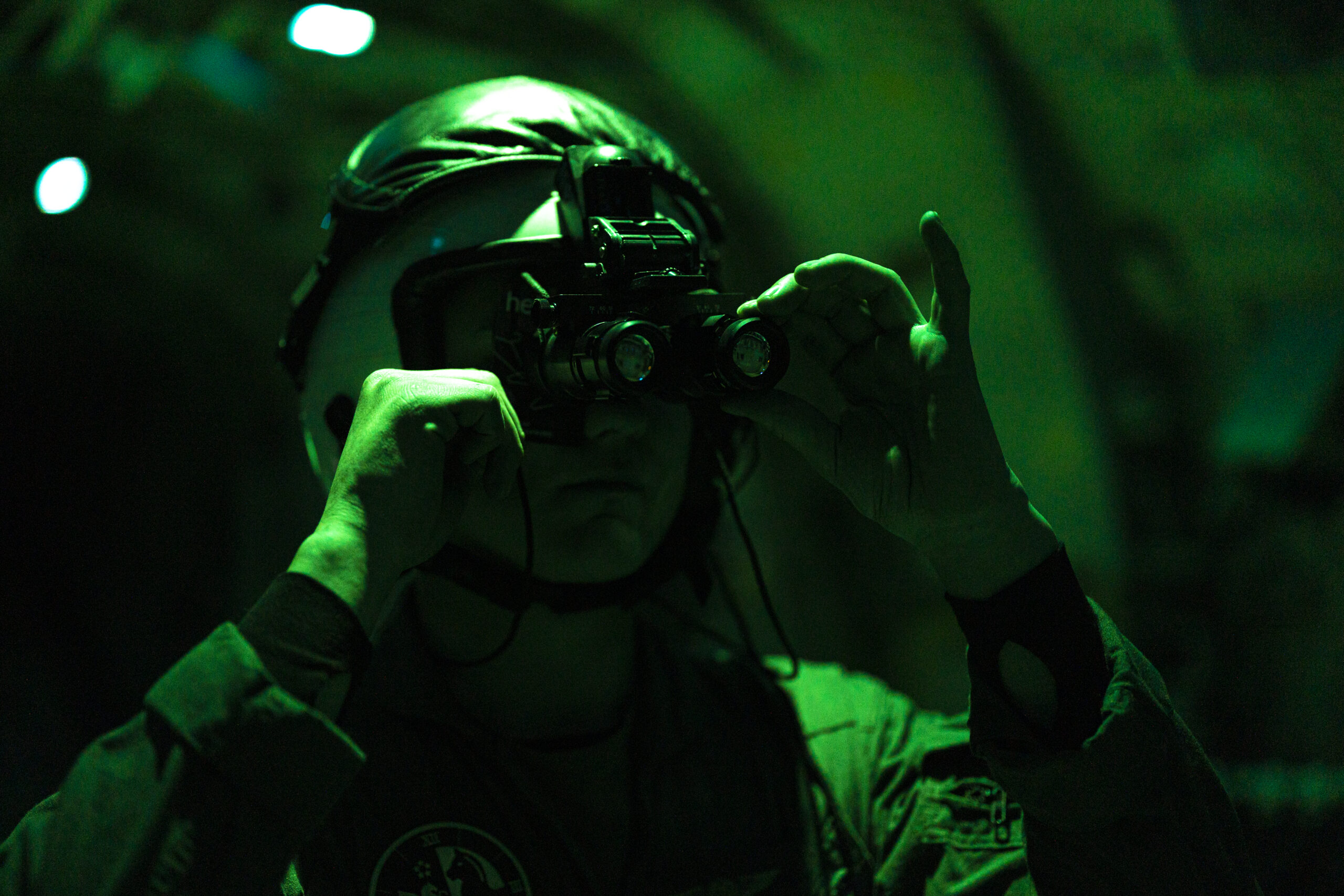 U.S. Marine Corps Cpl. Aron Tahdooahnippah, from Oklahoma, a fixed-wing aircraft loadmaster with Marine Aerial Refueler Transport Squadron (VMGR) 252, adjusts a night vision device near 8 Wing/Canadian Forces Base Trenton, Ontario, Jan. 18, 2025. VMGR-252 participated in a cold-weather training exercise alongside the Royal Canadian Air Force’s 436 Transport Squadron to improve interoperability and increase proficiency while operating KC-130J Super Hercules aircraft in cold and extreme cold weather conditions. (U.S. Marine Corps photo by Lance Cpl. Mya Seymour)
