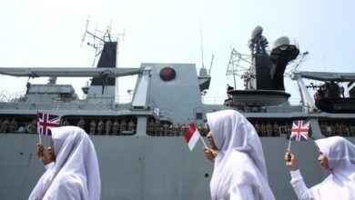 Childrens waves the UK and Indonesian flags as they welcoming the HMS Albion (L14) arrival at Terminal 2 Port of Tanjung Priok, Jakarta on Sunday, April 22, 2018. The arrival of the ship of HMS Albion and the Royal Navy crew is in order to strengthen cooperation between the British and Indonesian military.