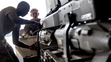 Servicemen guide in an unarmed practice GBU-39 Small Diameter Bomb SDB munition at Seymour Johnson Air Force Base, North Carolina