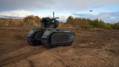 A Tracked Hybrid Modular Infantry System (THeMIS) unmanned ground vehicle firing on a drone