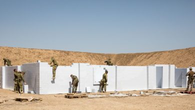 Australian and New Zealand soldiers with Task Group Taji, with the assistance of Iraqi instructors from the School of Infantry NCO II, install a new modular Urban Training Facility on Camp Taji, Iraq, June 2, 2019. The new training facility made of hardened plastic bricks will last much longer and allow for greater variety of training options than the wooden facades they are replacing. The Coalition focuses on providing training support, and equipment to enhance the professionalism, technical expertise and equipment capabilities of Iraqi Security Forces. (U.S. Army Reserve photo by Cpl. Tamara Cummings)