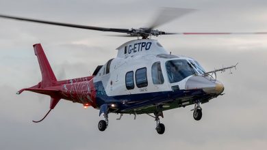 A QinetiQ helicopter in flight, featuring a critical component manufactured via 3D printing from recycled aircraft scrap metal.