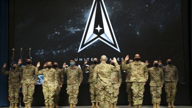 Service members take the oath of office officially transferring from the United State Air Force to the United States Space Force during a ceremony held at the Air Force Institute of Technology, Wright-Patterson Air Force Base Feb. 10, 2020. The Airmen transitioned into the Space Force as Guardians during the ceremony, joining some of the first Guardians to cross into the newest branch of the U.S. armed forces. (U.S. Air Force Photos by Senior Airman Caleb House