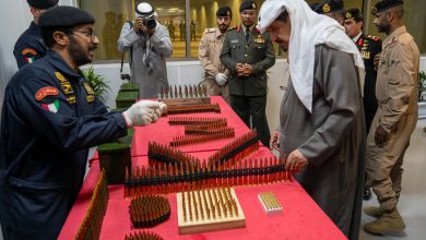 Kuwait's Prime Minister Sheikh Ahmad Abdullah Al-Ahmad Al-Sabah inspecting shells at a new ammunitions factory