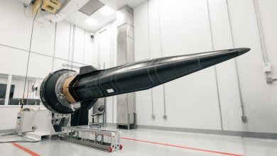 A hypersonic vehicle test article mounted on a ground-based test rig inside a laboratory, featuring a long, pointed nose and aerodynamic control surfaces.